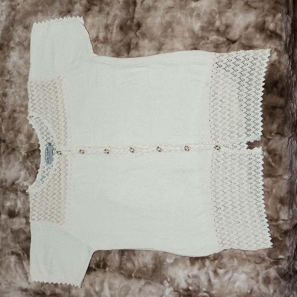 Women's cream colored hand loomed top with decorative buttons